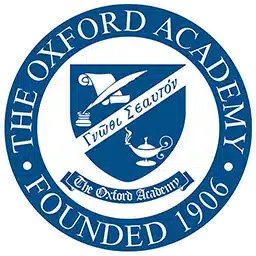 Blue and white circular logo for The Oxford Academy, founded in 1906, featuring a shield with a book, feather, lamp, and Greek text.